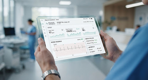 A clinician reviewing patient vitals in Enhanced OpenEMR on a tablet